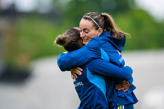 Madelen Janogy and Kosovare Asllani of the Swedish