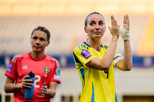 Goalkeeper Jennifer Falk and Kosovare Asllani of Sweden