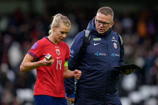 Ada Hegerberg and media officer Henning Sverdrup of Norway