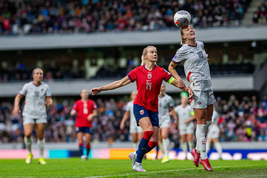 Ada Hegerberg of Norway and Dagny Brynjarsdottir of Iceland