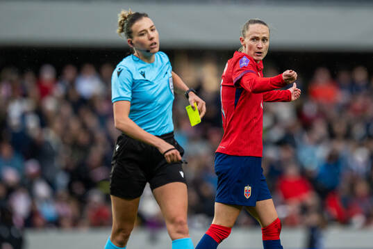 Caroline Graham Hansen of Norway receives a yellow card