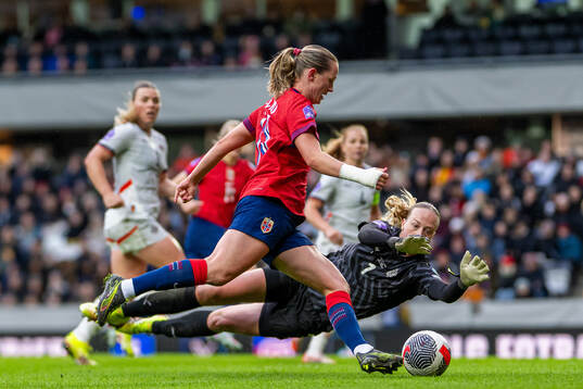 Elisabeth Terland of Norway and goalkeeper Cecilia Rán