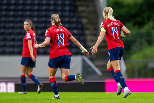 Elisabeth Terland and Ada Hegerberg of Norway celebrate