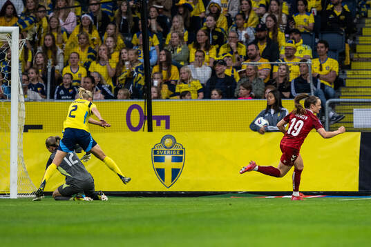 goalkeeper Jennifer Falk and Jonna Andersson of Sweden look