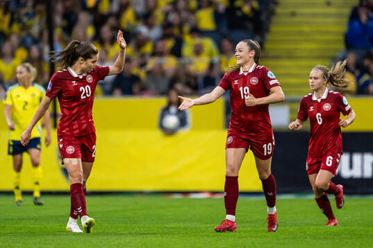 Signe Kallesøe Bruun and Janni Thomsen of Denmark celebrate