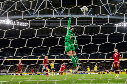 Lina Hurtig of Sweden scores 6-1 behind goalkeeper Maja Bay