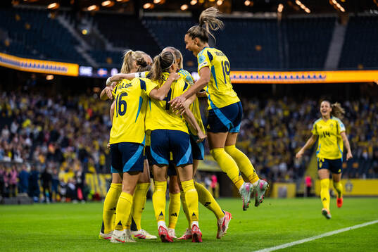 Stina Blackstenius of Sweden celebrates with team mates