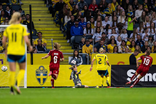 Janni Thomsen of Denmark scores 3-1 past goalkeeper