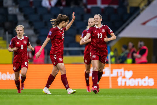 Signe Kallesøe Bruun and Janni Thomsen of Denmark celebrate