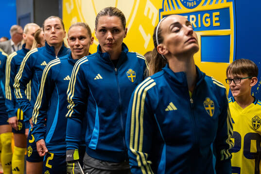 goalkeeper Jennifer Falk and Kosovare Asllani of Sweden