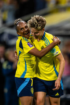 Madelen Janogy and Lina Hurtig of Sweden celebrate