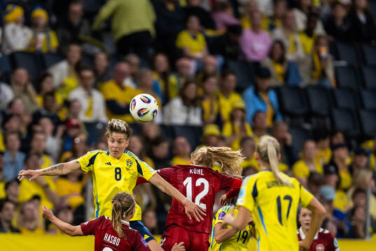 Lina Hurtig of Sweden competes for the ball with  Josefine