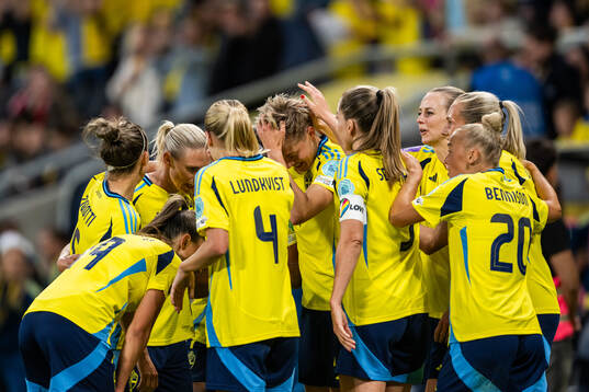 Lina Hurtig of Sweden celebrates with team mates