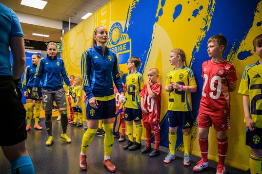 Goalkeeper Jennifer Falk and Kosovare Asllani of Sweden