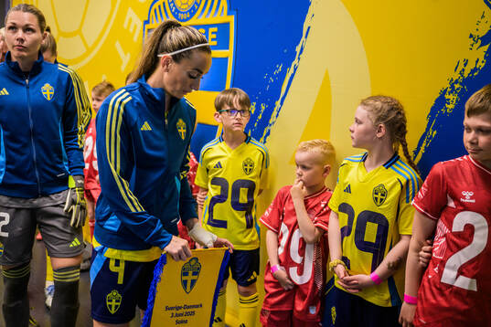 Goalkeeper Jennifer Falk and Kosovare Asllani of Sweden