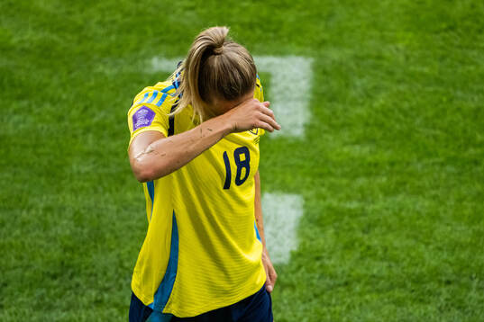 Fridolina Rolfö of Sweden leaves the pitch due to injury