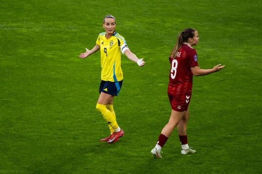 Kosovare Asllani of Sweden and Emma Snerle of Denmark react