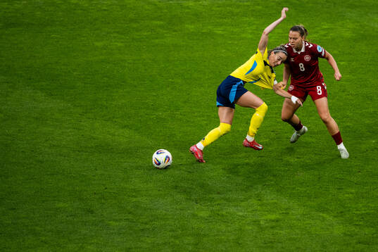Kosovare Asllani of Sweden and Emma Snerle of Denmark