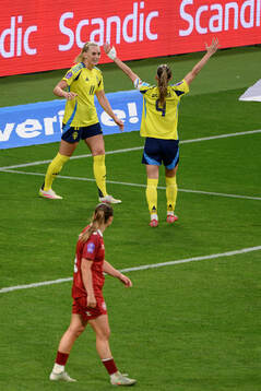 Stina Blackstenius and Kosovare Asllani of Sweden celebrate