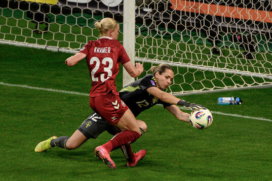 Cornelia Kramer of Denmark against goalkeeper Jennifer Falk