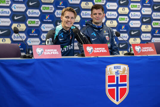 Martin Ødegaard and press officer Morten Morisbak