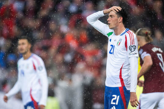 Alessandro Bastoni of Italy looks dejected