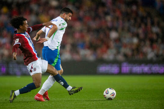 Oscar Bobb of Norway and Riccardo Orsolini iof Italy