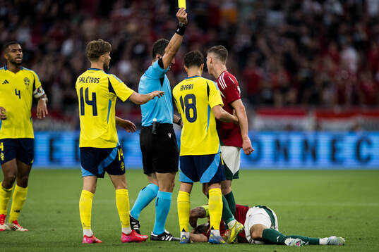 Yasin Ayari of Sweden receives a yellow card from referee