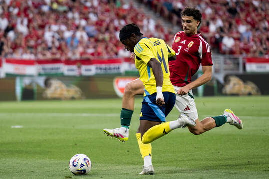 Anthony Elanga of Sweden and Botond Balogh of Hungary