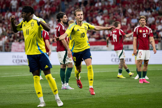 Benjamin Nygren of Sweden celebrates with Emil Holm and