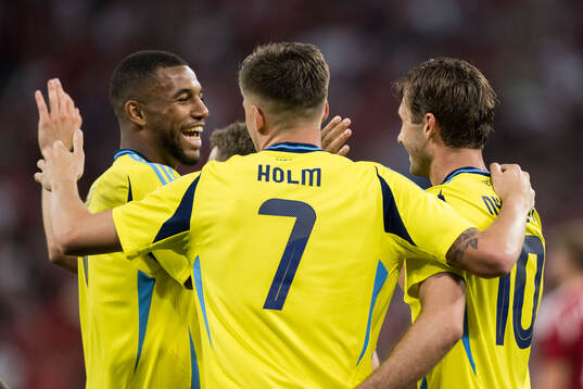 Isak Hien, Emil Holm and Benjamin Nygren of Sweden celebrate