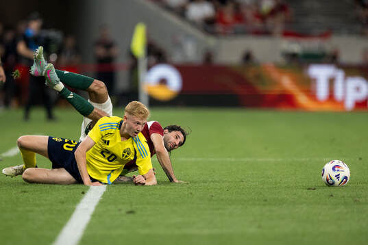 Hugo Larsson of Sweden and Dominik Szoboszlai of Hungary