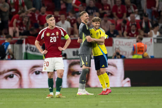 Roland Sallai of Hungary beside goalkeeper Robin Olsen and