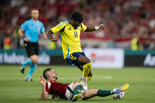Zsolt Nagy of Hungary and Anthony Elanga of Sweden