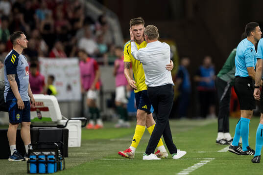 Emil Holm and Head coach Jon Dahl Tomasson of Sweden