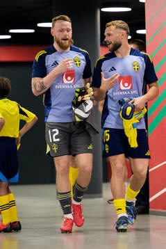 Goalkeeper Viktor Johansson and Jesper Karlström of Sweden