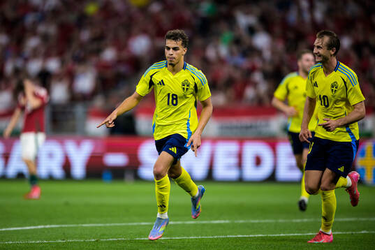 Yasin Ayari and Benjamin Nygren of Sweden celebrate the 0-2