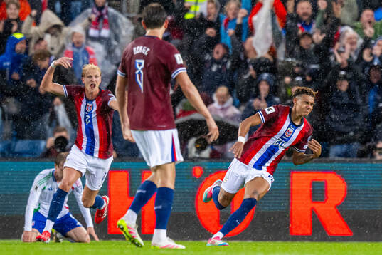 Antonio Nusa of Norway celebrates with teammate Morten