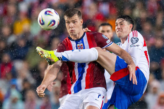 Alexander Sørloth of Norway and Alessandro Bastoni of Italy