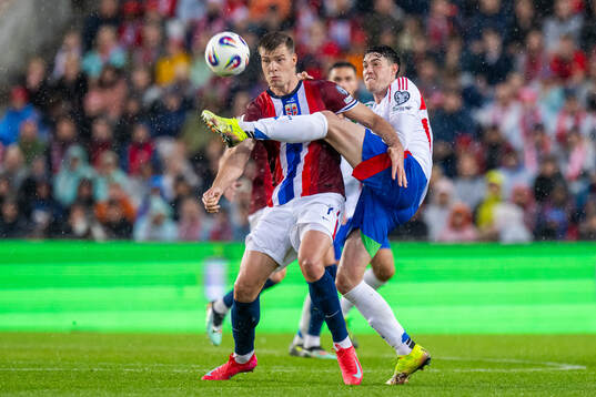 Alexander Sørloth of Norway and Alessandro Bastoni of Italy