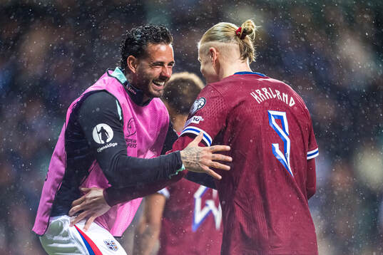 Erling Braut Haaland of Norway celebrates with Aron Dønnum