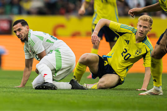 Ismael Bennacer of Algeria and Hugo Larsson of Sweden