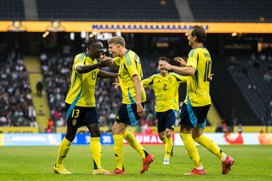 Ken Sema and Alexander Bernhardsson of Sweden celebrating