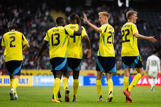 Ken Sema of Sweden celebrates with Isak Hien, Hugo Larsson