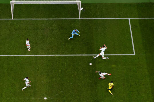 Ken Sema of Sweden scores 1-0 behind goalkeeper Anthony
