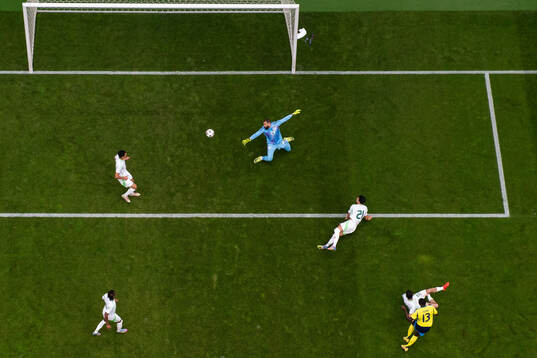 Ken Sema of Sweden scores 1-0 behind goalkeeper Anthony