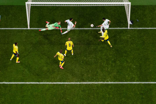 Yassine Benzia of Algeria scores 4-2 behind goalkeeper