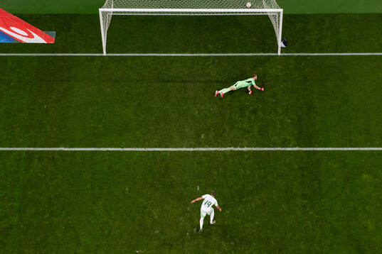 Nabil Bentaleb of Algeria scores 4-3 behind goalkeeper
