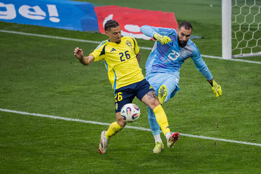 Jordan Larsson of Sweden and goalkeeper Anthony Mandrea of