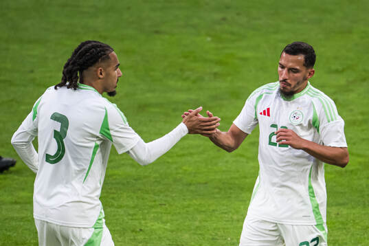 Ismael Bennacer of Algeria celebrate with Mohamed Farsi